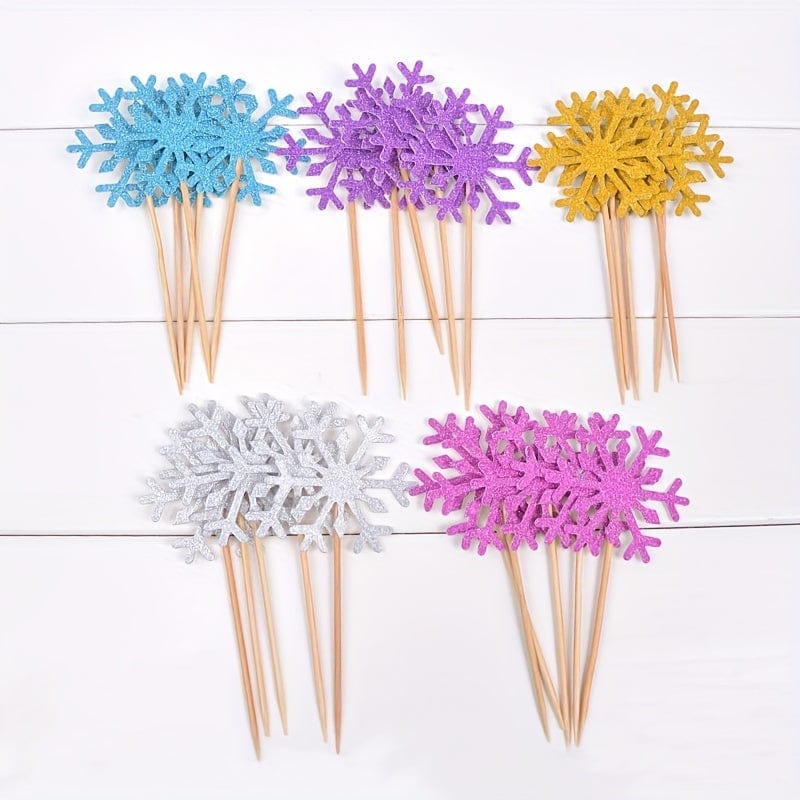 5 bunches of Snow flake cake toppers on counter