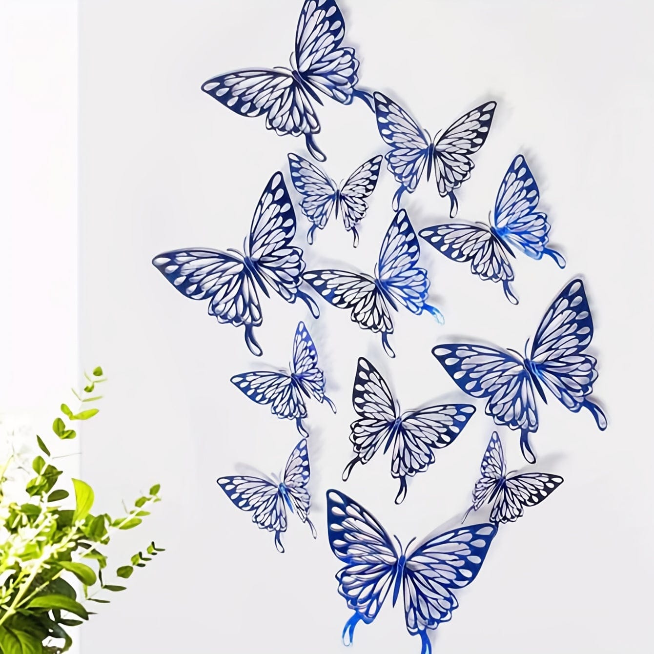 Blue butterflies on white wall