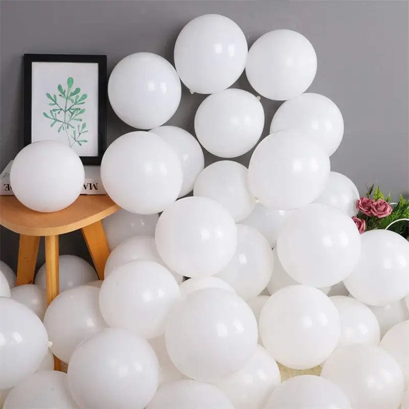 White 10 inch balloons in corner of room