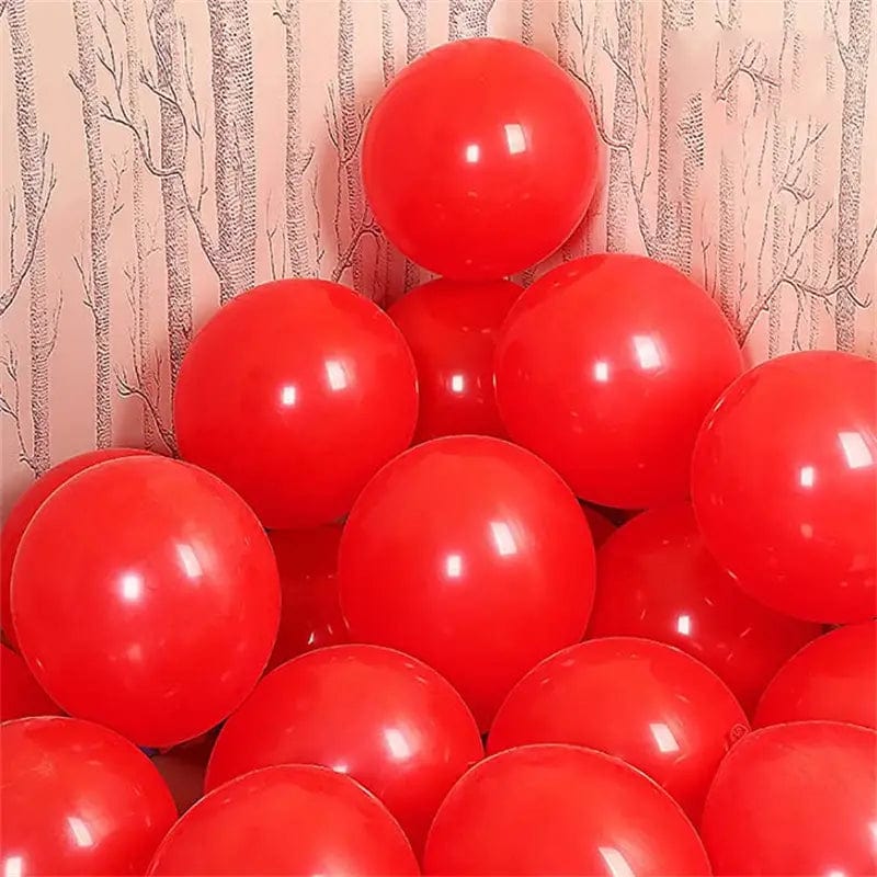 Red 10 inch balloons in corner of room