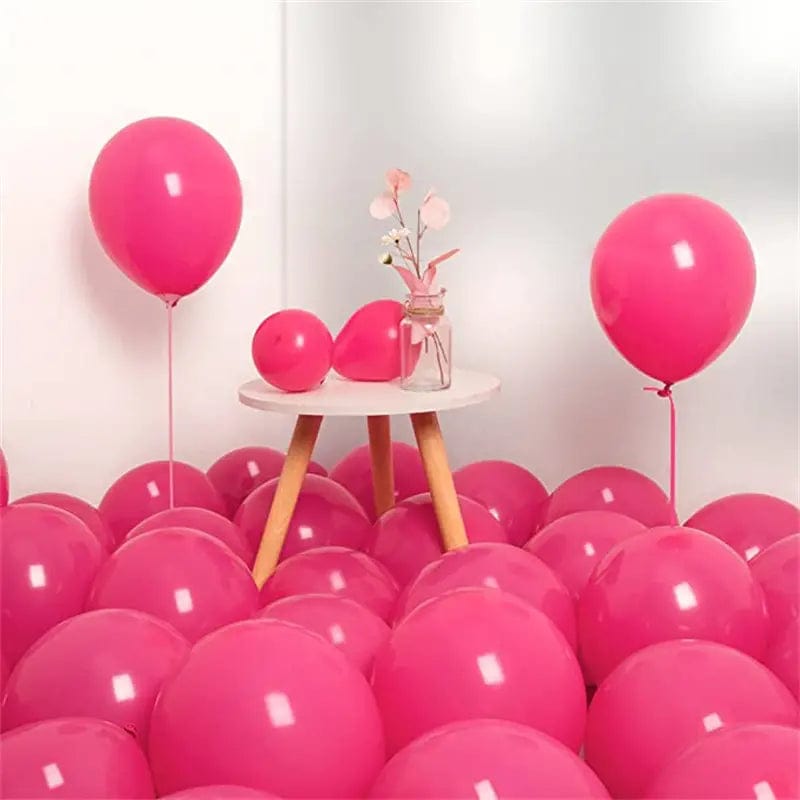 Rose Red 10 inch balloons in corner of room