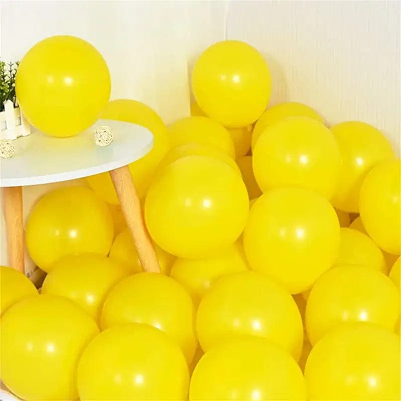 Yellow 10 inch balloons in corner of room