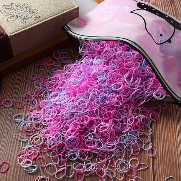 colorful mini nylon hair ties spilling out of bag