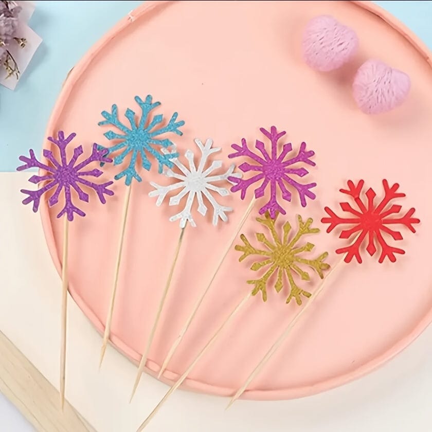 6 snowflakes on picks laying on plate
