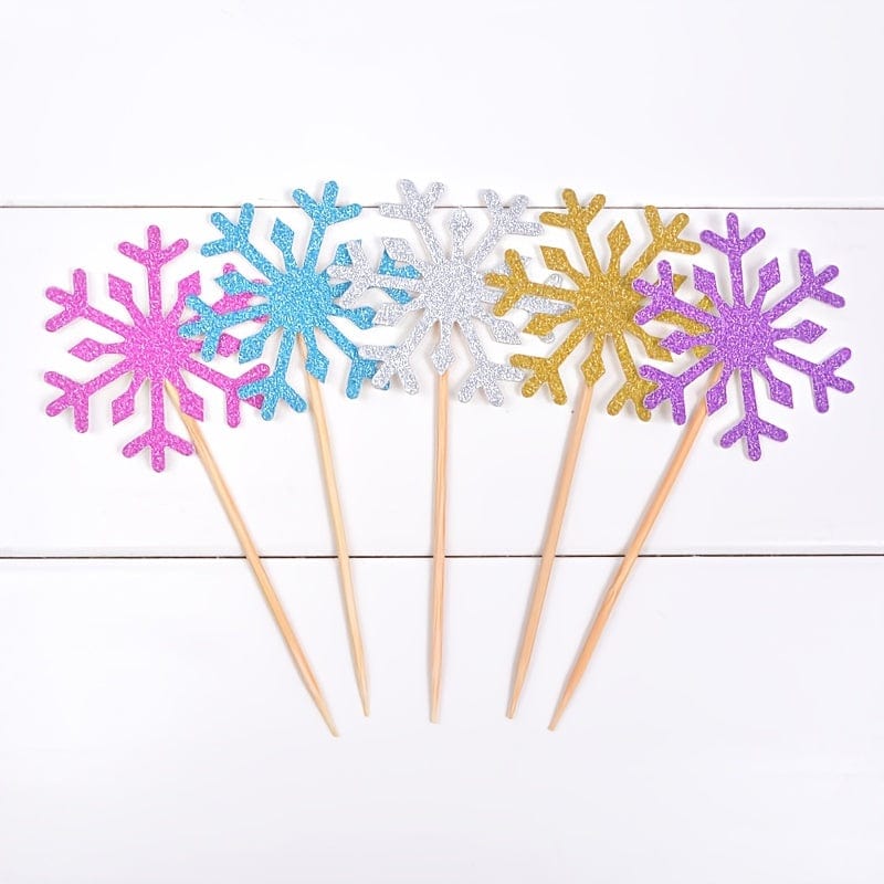 5 Snow flake cake toppers on counter