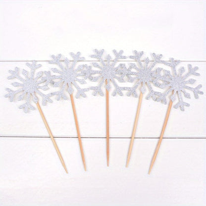 5  Silver Snow flake cake toppers on counter