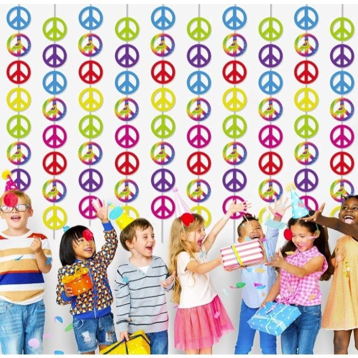tie die peace sign garland hanging with kids celebrating in front of it