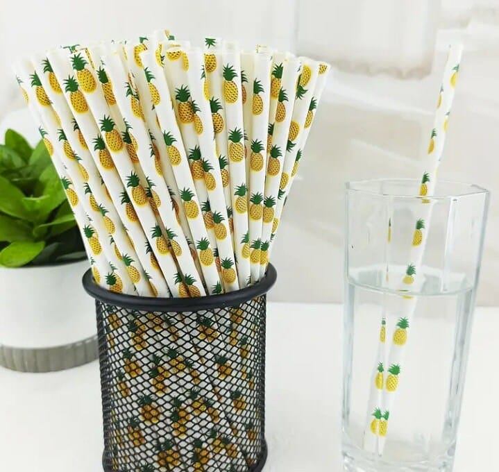 pineapple on a group of white paper straws