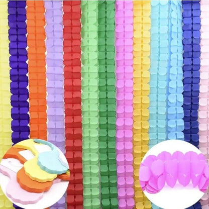 Assorted color four leaf clover garland hanging from ceiling 