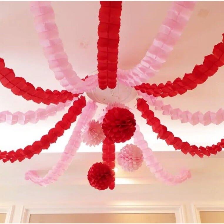 red and pink four leaf clover garland hanging on ceiling 