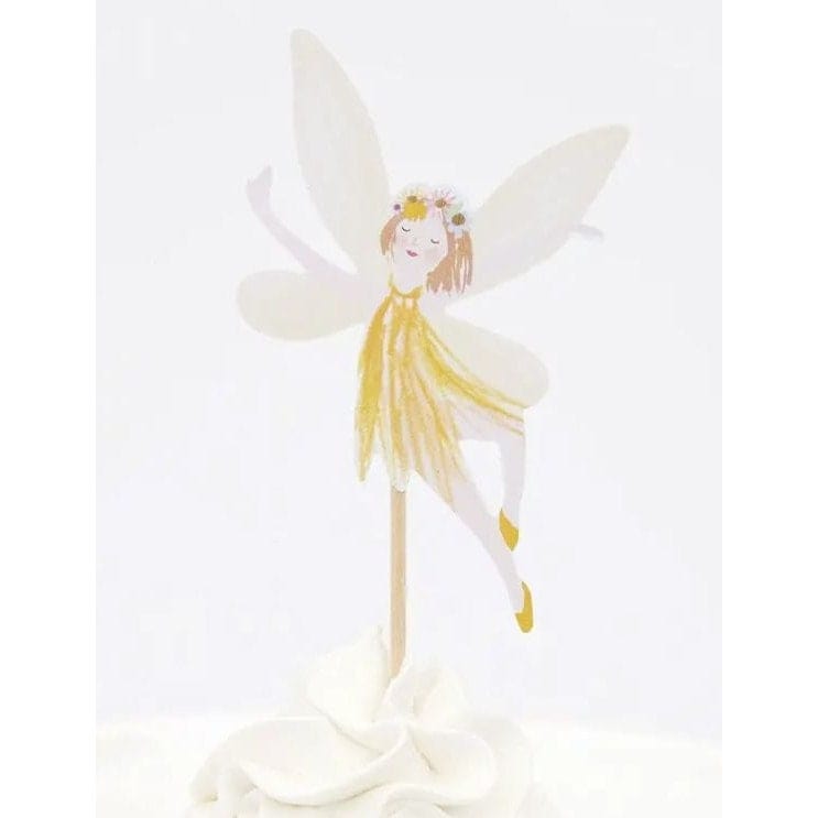Fairy with yellow dress on pick in a cupcake